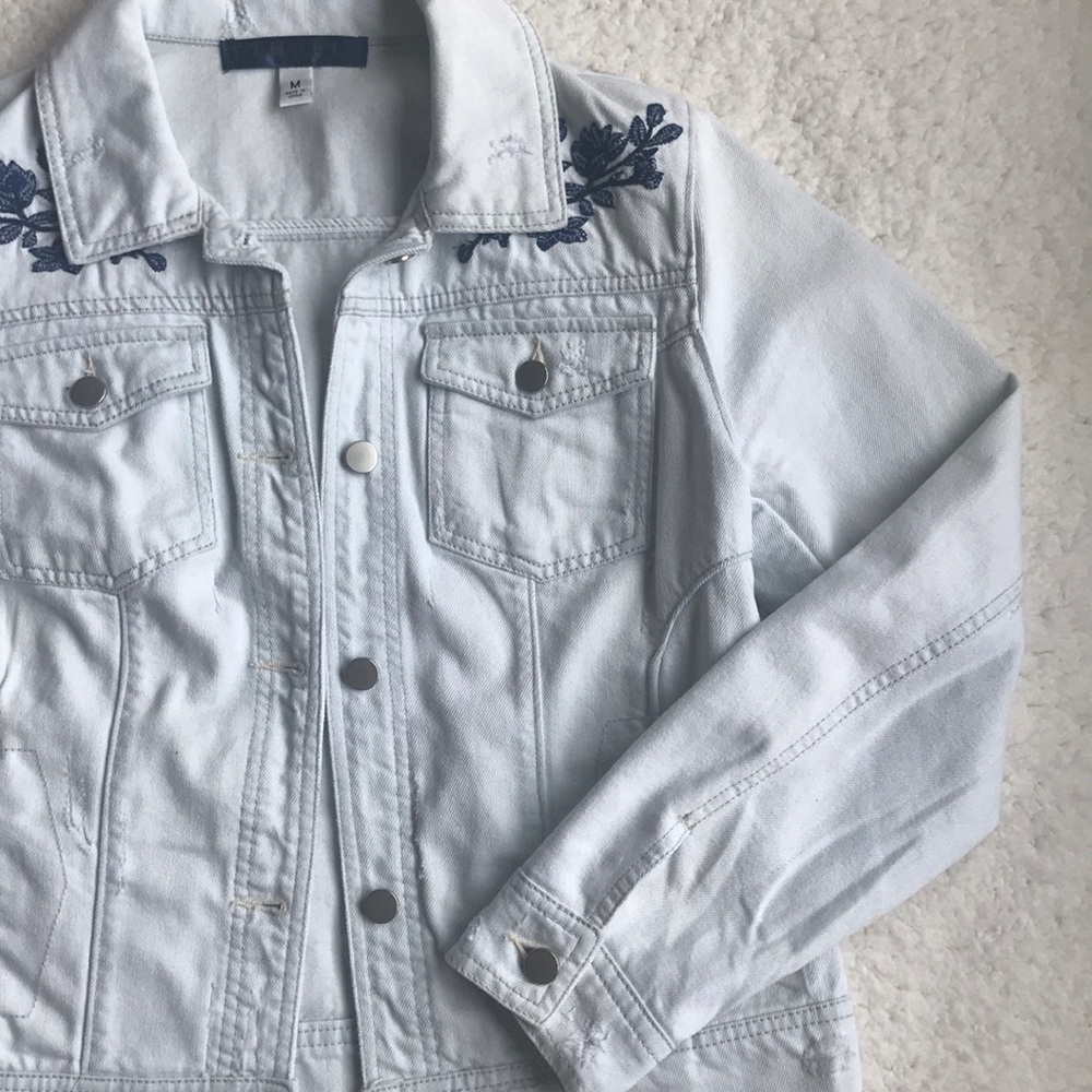 Stylish ripped and embroidered jean jacket